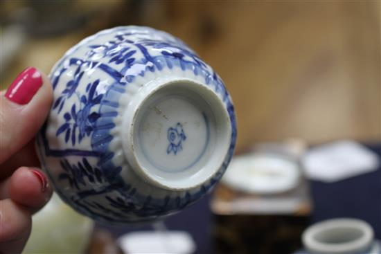 A Chinese blue and white tea bowl and saucer and two jars, Kangxi, some damage, largest diameter 11cm